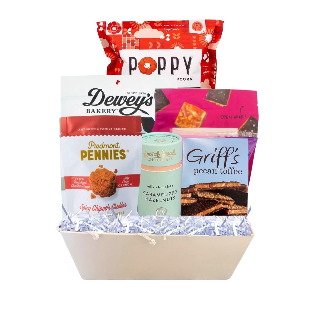 gourmet gift basket full of NC made products. including POppy popcorn, Legally addictive cookies, French broad hazelnuts, sweethearts conversation hearts, deweys cookies