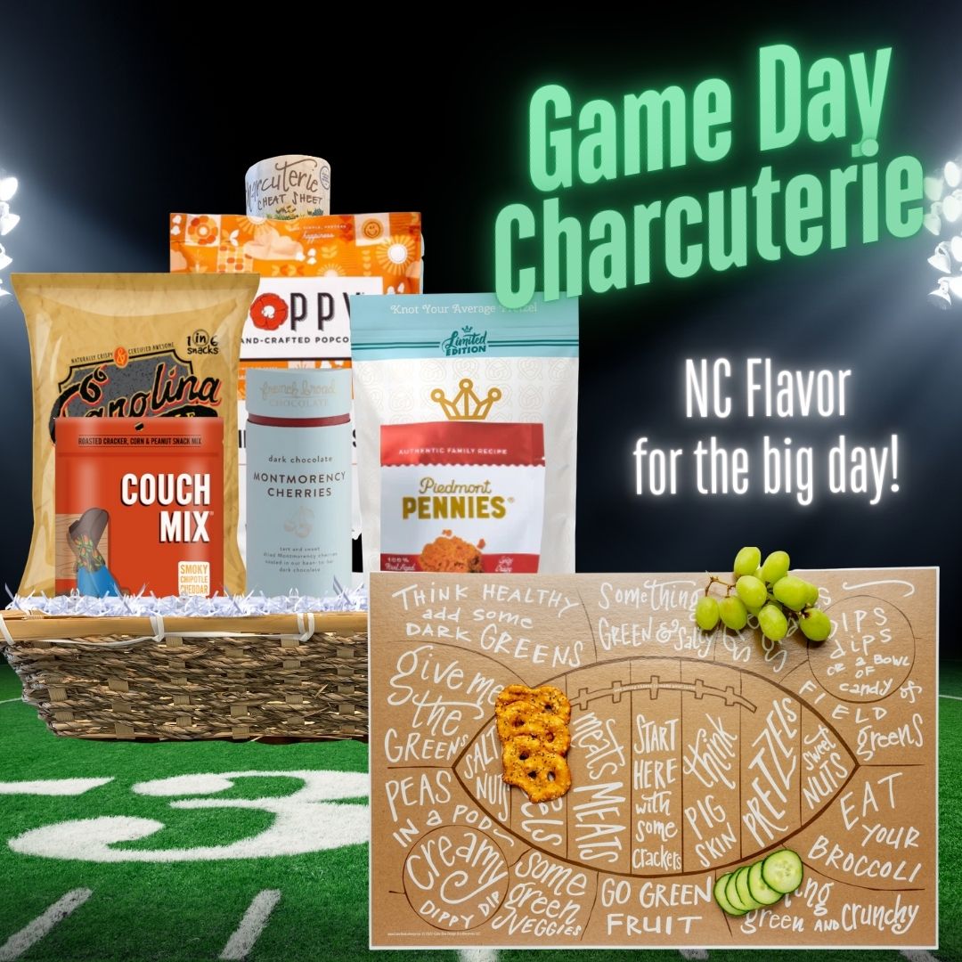 Game day charcuterie board with snacks and a football-themed sign on a sports field background.
