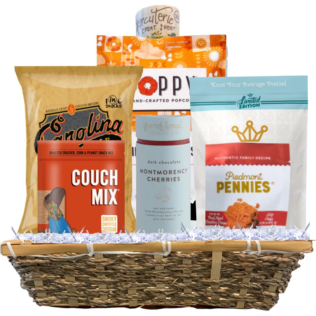 Gift basket full of made in NC gourmet food products that van be arranged on the included football shaped charcuterie mat