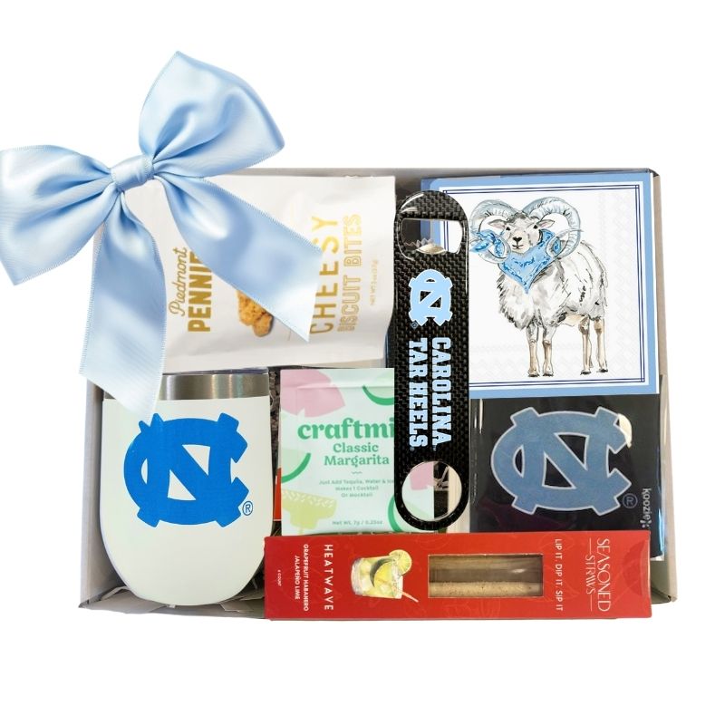 Carolina Celebration Gift Kit featuring a UNC Tumbler with Lid, UNC Ram Beverage Napkins, and an officially licensed UNC Bottle Opener, all neatly packaged