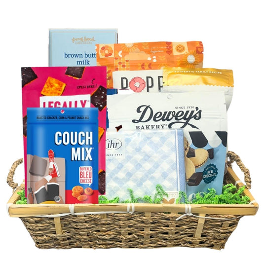 Easter gift basket full of gourmet foods that are made in North Carolina, including cookies, chocolates, cheese straws, popcorn, and beverage napkins.