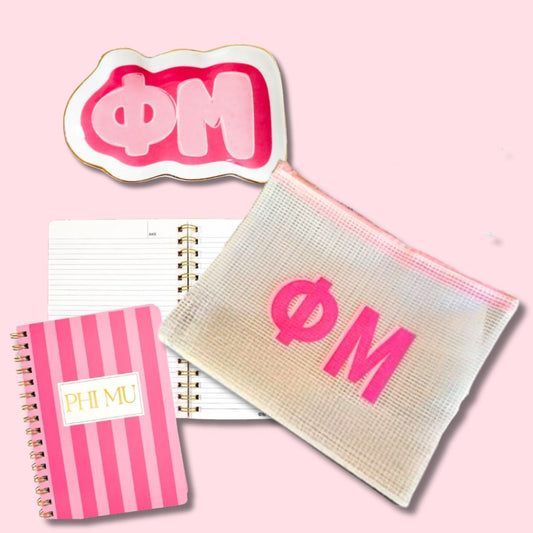 flat lay of Phi Mu items included in Sorority gift for sisters on bid day