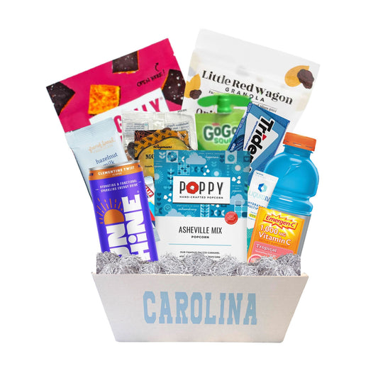Carolina bucket full of exam study snacks and UNC licensed products. Contains made in North Carolina local foods such as Legally addictive cookies and Poppy's popcorn