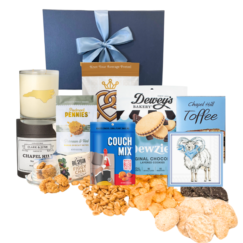 Chapel Hill Signature Gift Set featuring premium UNC gifts and locally made treats like chocolates, pretzels, and cheese wafers, displayed in front of the navy gift box