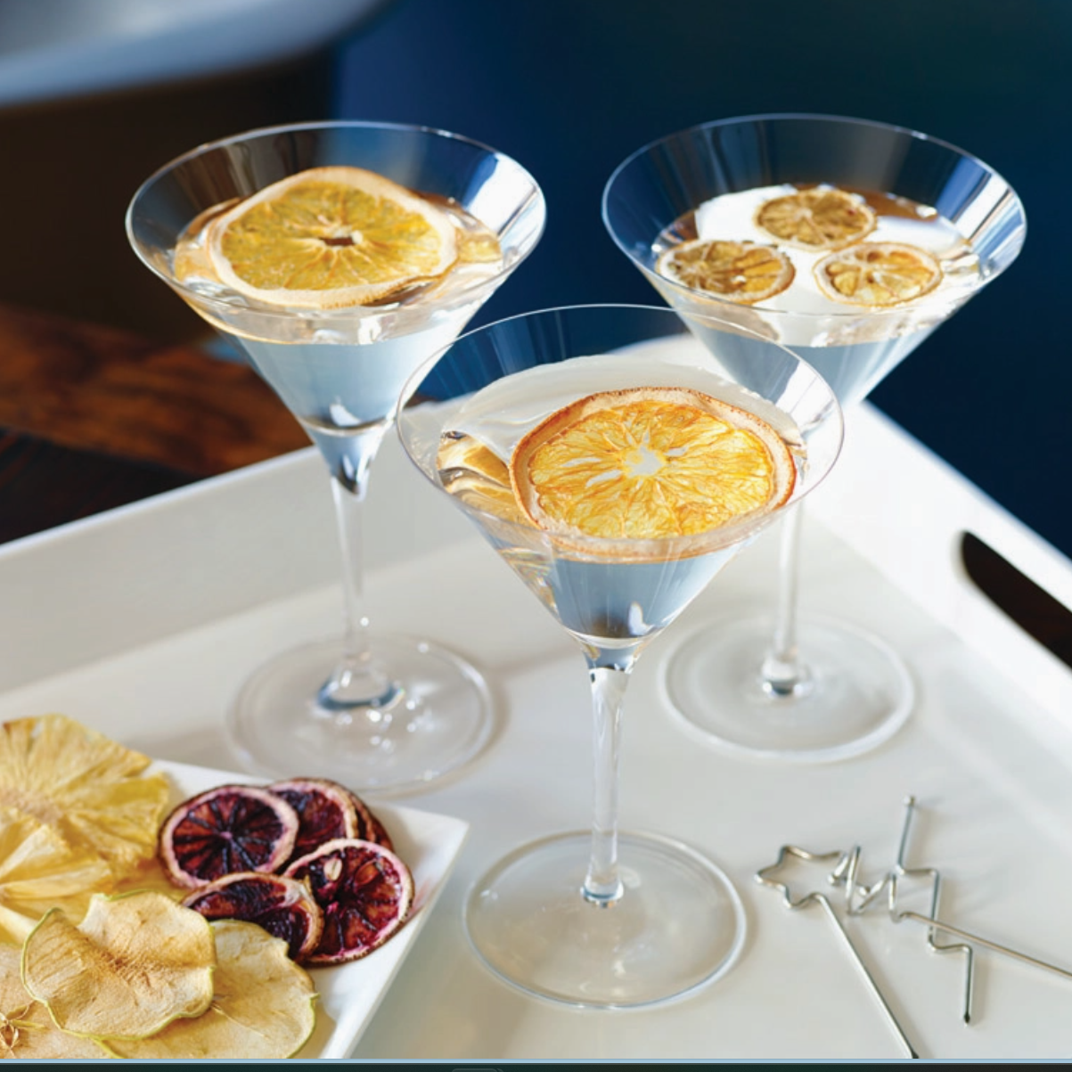 Lifestyle image showing two cocktail glasses with orange slices floating on top, highlighting the elegant garnish included in the Men’s Old Fashioned Gift Box.