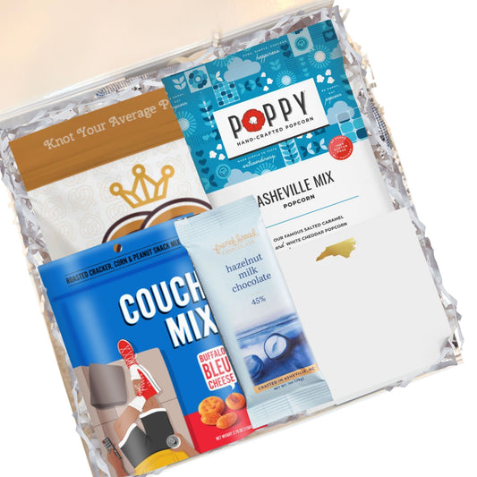 North Carolina corporate welcome box contents with gourmet popcorn, chocolate, and artisan snacks