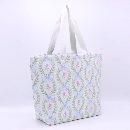 Floral insulated tote bag with metallic gold Greek letters and white straps, displayed against a white background – perfect for sorority gifts or everyday use.