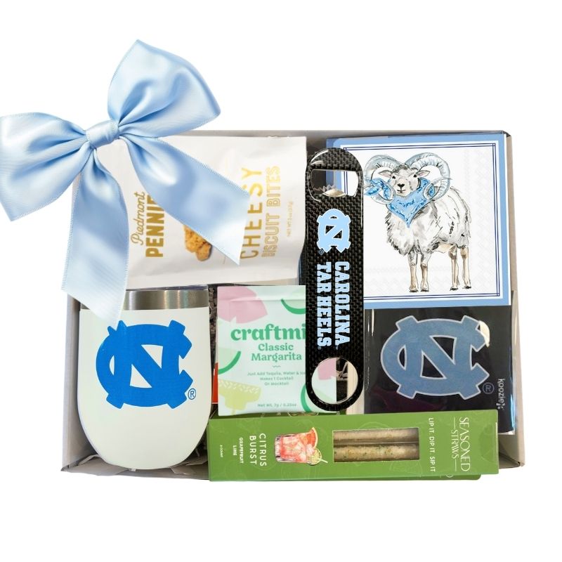 Carolina Celebration Gift Kit featuring a UNC Tumbler with Lid, UNC Ram Beverage Napkins, and an officially licensed UNC Bottle Opener, all neatly packaged