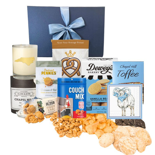 Chapel Hill Signature Gift Set featuring premium UNC gifts and locally made treats like chocolates, pretzels, and cheese wafers, displayed in front of the navy gift box