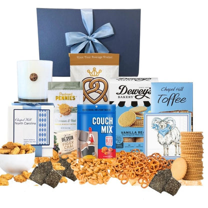 Chapel Hill Signature Gift Set featuring premium UNC gifts and locally made treats like chocolates, pretzels, and cheese wafers, displayed in front of the navy gift box