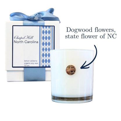 Luxury candle with UNC Chapel Hill argyle and gold emblem of dogwood flowers, state flower of NC