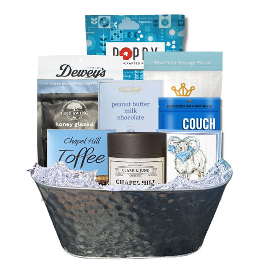 Carolina Blue Deluxe Gift Basket filled with UNC-branded items and premium North Carolina-made treats, perfect for celebrating Tar Heel pride and local flavors.