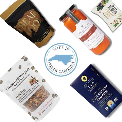 North Carolina wellness gift basket contents with dark chocolate, nut butter bar, and artisan granola