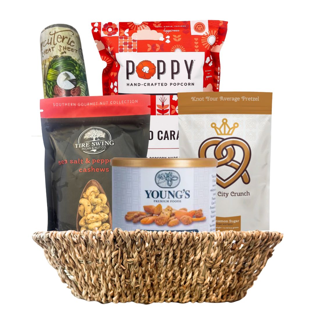 Basket filled with various snacks and treats on a white background