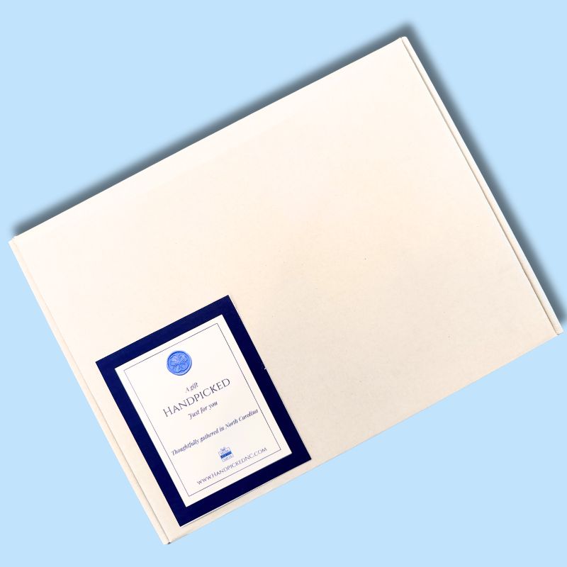 Overhead view of the closed Carolina Sampler gourmet shipping box with a Handpicked Gifts label