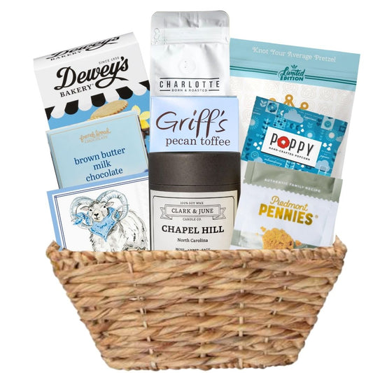 Carolina Blue Deluxe Gift Basket filled with UNC-branded items and premium North Carolina-made treats, perfect for celebrating Tar Heel pride and local flavors.