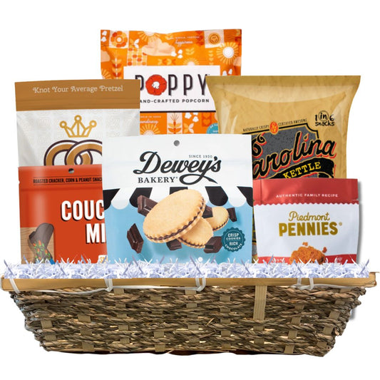 Large woven basket full of locally made NC gourmet snacks including savory and sweet options for Tar Heels 