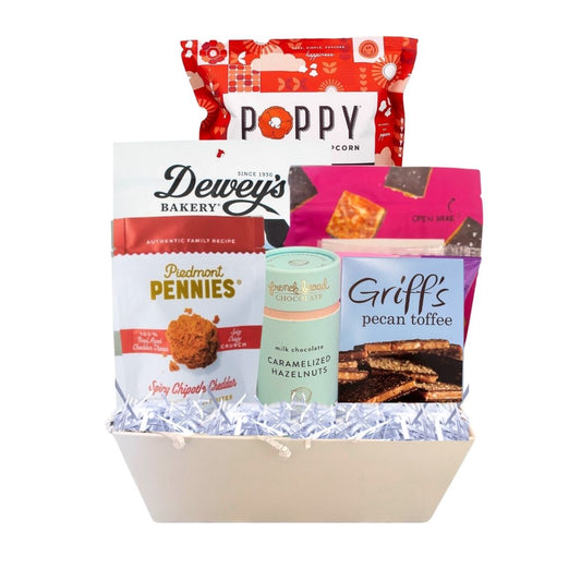 gourmet gift basket full of NC made products. including POppy popcorn, Legally addictive cookies, French broad hazelnuts, sweethearts conversation hearts, deweys cookies