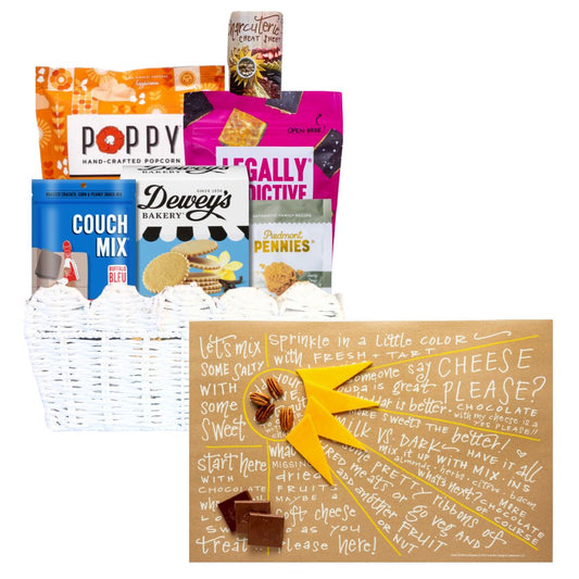 Sunburst Charcuterie Gift Basket with open charcuterie cheat sheet showcasing NC-made gourmet treats including popcorn, cookies, and cheese wafers.