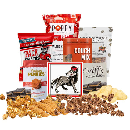 NC State-themed gift basket contents arranged on a countertop with small piles of each snack in front, showcasing red-packaged North Carolina-made gourmet treats