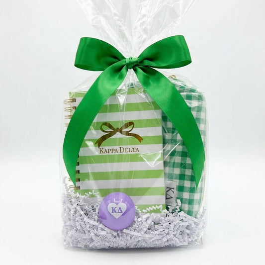 Gift package with green ribbon, striped and checkered paper, and Kappa Delta logo on a white background