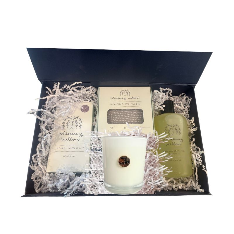 Alternate angle of open luxury gift box displaying lavender self-care items, showcasing elegant presentation of candle, body wash, linen spray, and eye pillow