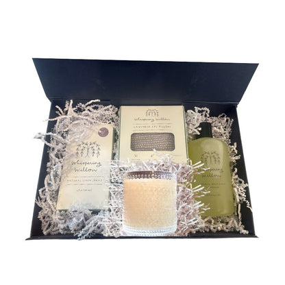 Alternate angle of open luxury gift box displaying lavender self-care items, showcasing elegant presentation of candle, body wash, linen spray, and eye pillow