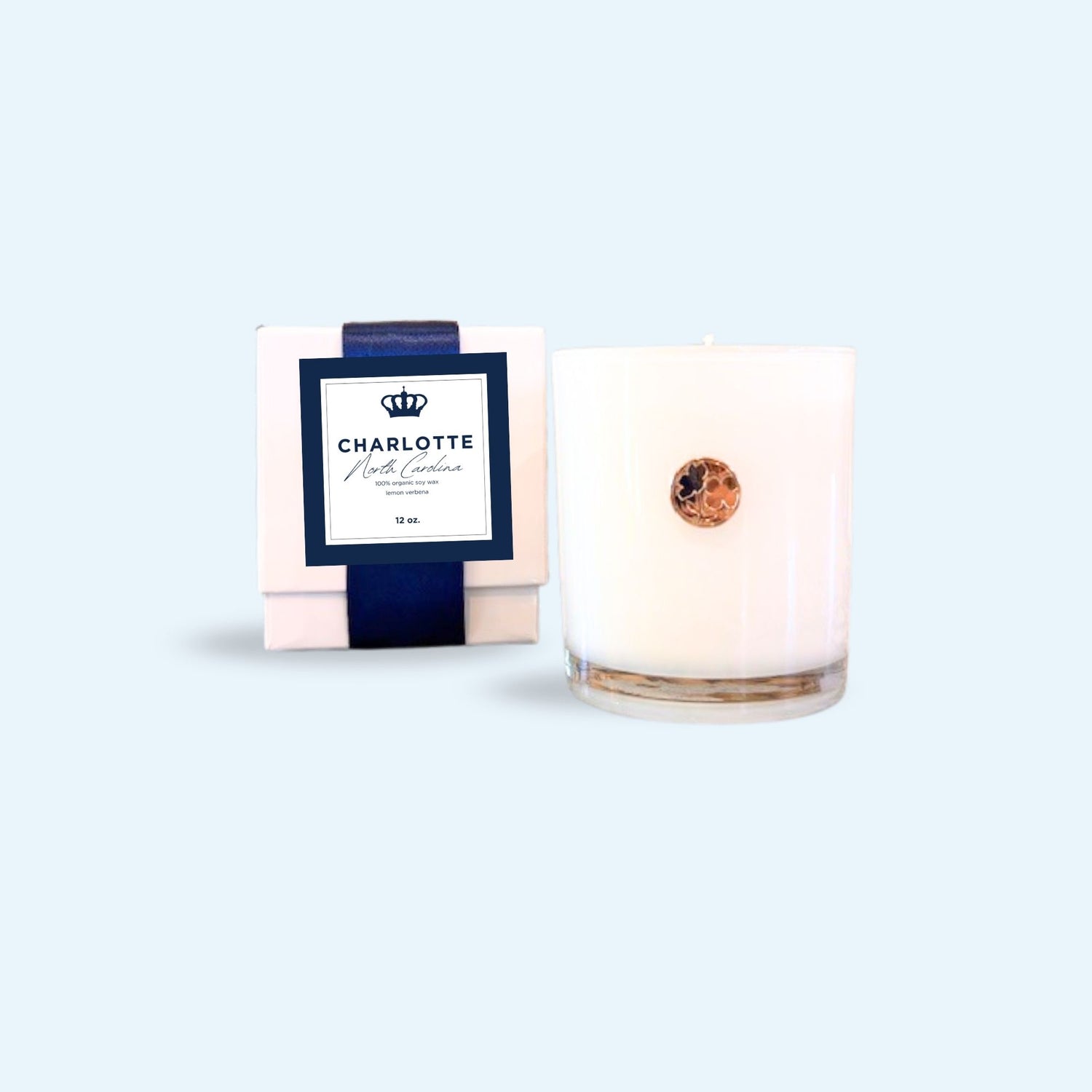 Luxury candle celebrating Charlotte, North Carolina with a crown for the Queen city and a dogwood emblem as the state flower of NC