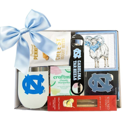 Carolina Celebration Gift Kit featuring a UNC  Tumbler with Lid, UNC Ram Beverage Napkins, and an officially licensed UNC Bottle Opener, all neatly packaged