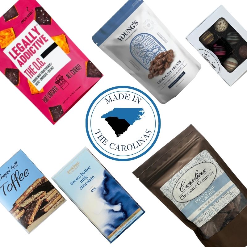 Flat lay of the Chocolate Lover’s Delight gourmet gift box featuring artisan chocolate cookies, toffee, chocolate bars, truffles, chocolate clusters, and chocolate-covered pecans, with a central emblem reading “Made in the Carolinas,” highlighting North and South Carolina–made sweets.