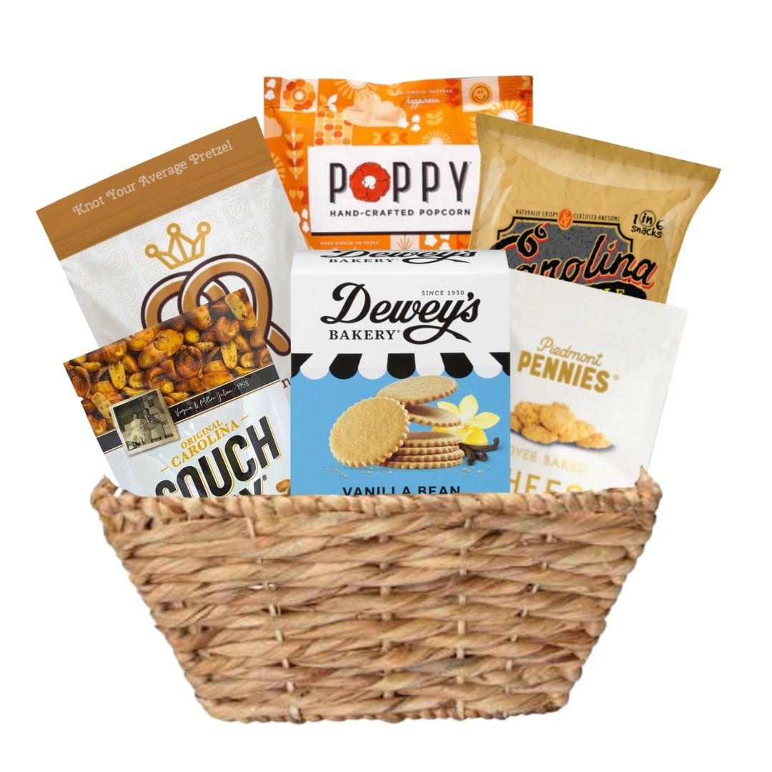 Large woven basket full of locally made NC gourmet snacks including savory and sweet options for Tar Heels 