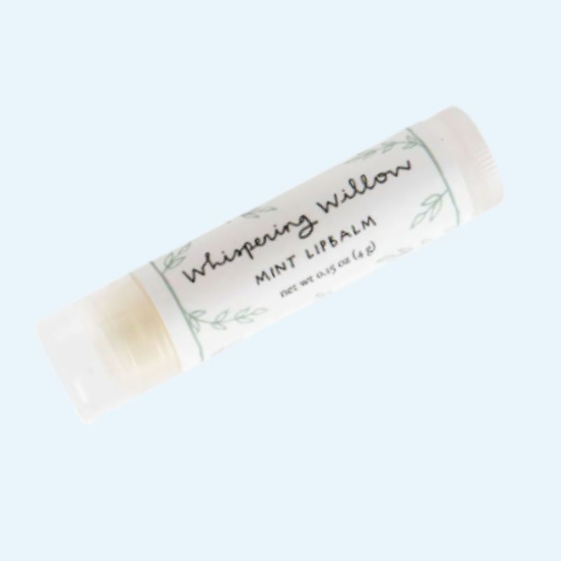 Lip balm stick with 'Whispering Willow' branding on a light background, part of Carolina Comfort and Care box