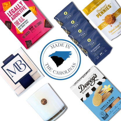 Assorted food products contained in elegant realtor closing gift with 'Made in the Carolinas' logo in the center.