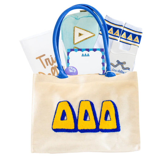 Tote bag with Greek letters, socks, and other items on a white background