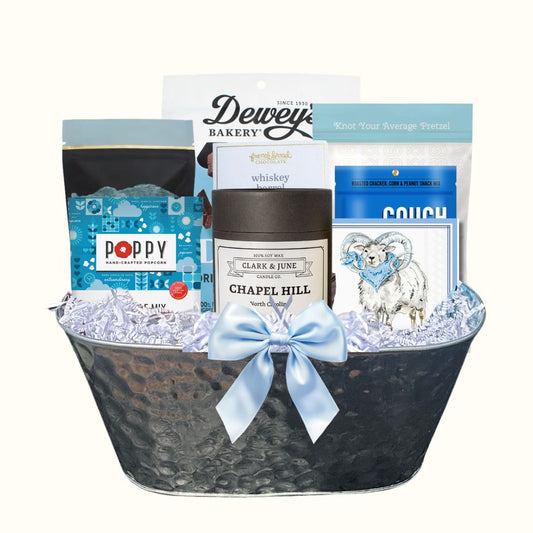 UNC Carolina Blue gift basket with North Carolina artisan treats and keepsake candle for Tar Heel fans