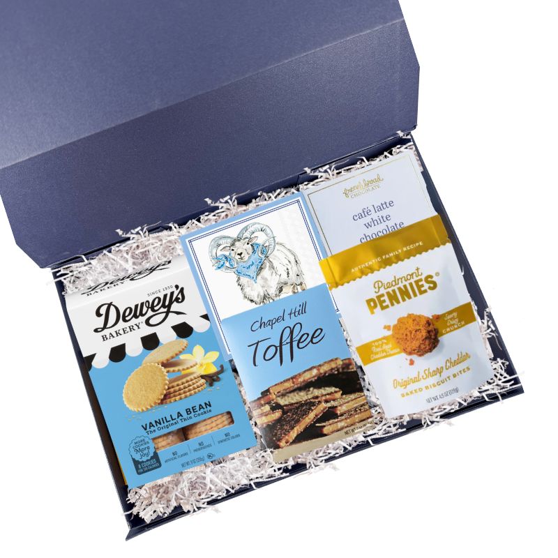 UNC snack gift box with North Carolina specialty treats and Tar Heels napkins in luxury gift box