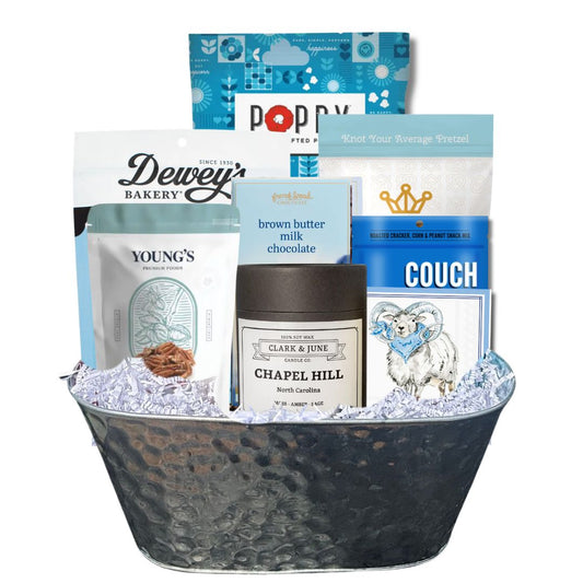 UNC Carolina Blue gift basket with North Carolina artisan treats and keepsake candle for Tar Heel fans