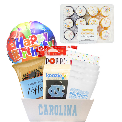 Carolina gift basket full of gliten free treats and UNC Chapel HIll branded merchandise for a student's birthday who is gluten free