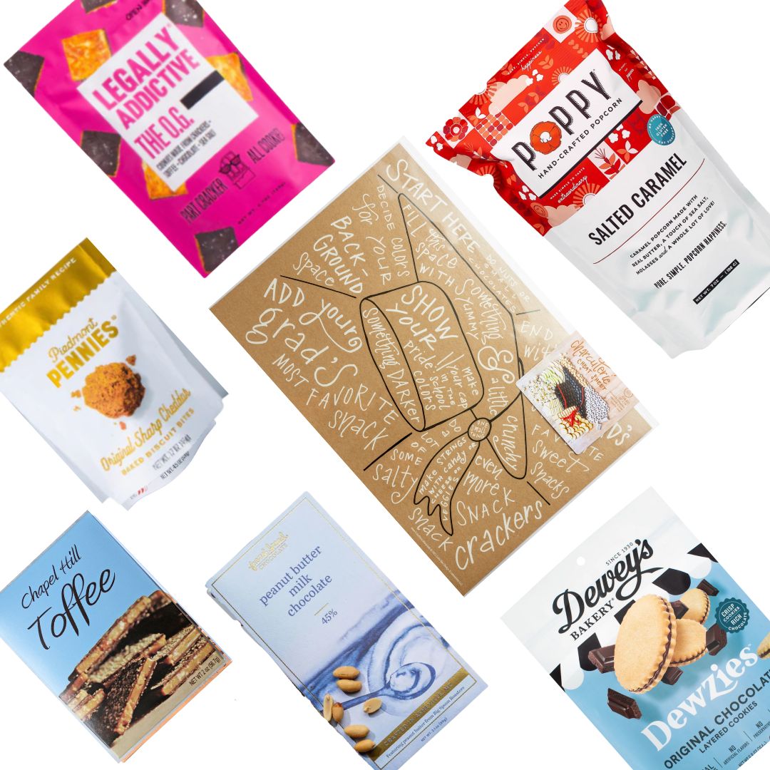 flat lay display of graduation gift basket contents, including graduation cap charcuterie mat and locally made north carolina foods