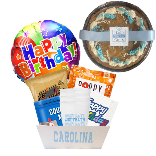 gift basket containing cookie cake, NC made chips Poppy POpcorn, Couch Mix, napkins, and a UNC cups to be delivered to UNC students at Chapel Hill. Everything that is included will make for a birthday in a basket so that students can enjoy a dorm birthday party with their friends.