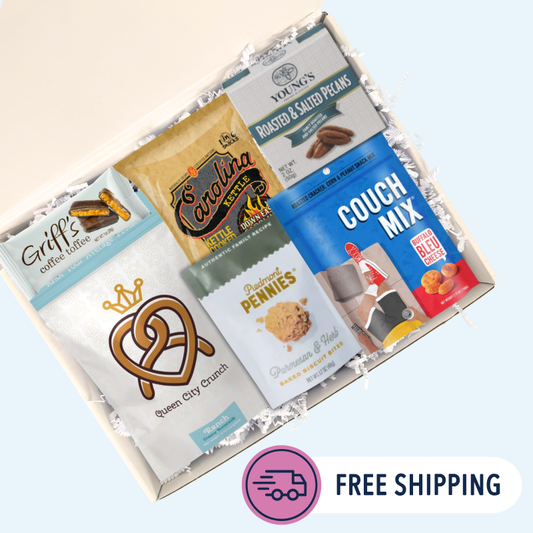  Overhead view of Carolina Sampler gift box open with BBQ chips, toffee, pecans, and pretzels arranged inside