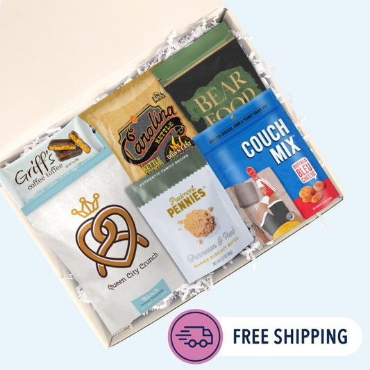  Overhead view of Carolina Sampler gift box open with BBQ chips, toffee, pecans, and pretzels arranged inside