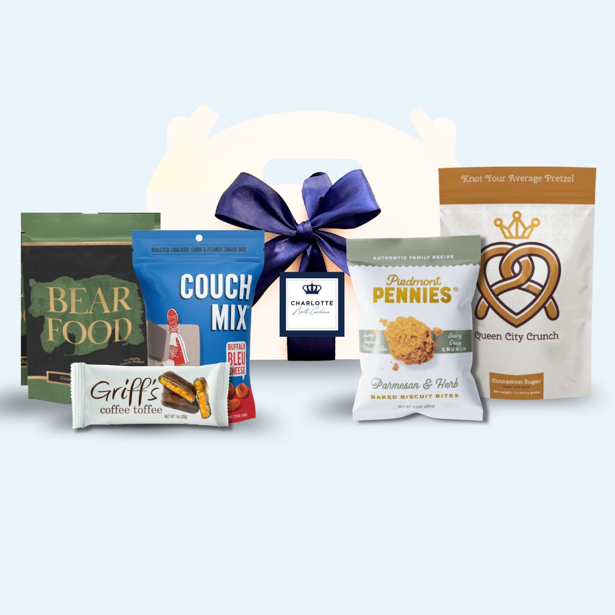 Charlotte NC artisan corporate event welcome box with Queen City crown label and blue ribbon