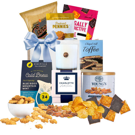Charlotte NC corporate welcome gift contents featuring Carolina specialty goods and keepsake soy candle from Handpicked Gifts NC