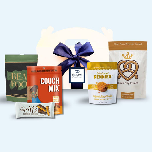 Charlotte NC artisan corporate event welcome box with Queen City crown label and blue ribbon