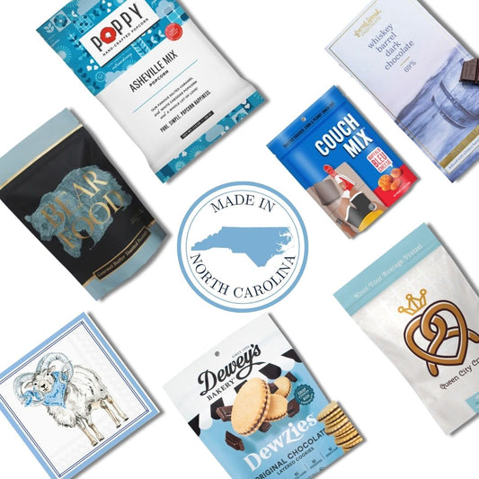 UNC gourmet gift basket contents with Chapel Hill artisan treats and Carolina Blue keepsake candle