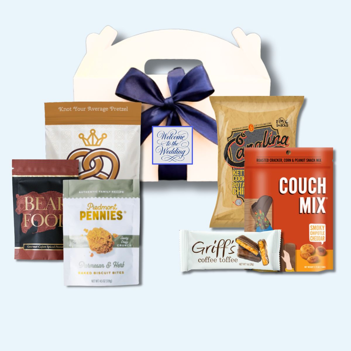Custom monogram Carolina specialty goods wedding welcome box with personalized label and blue ribbon