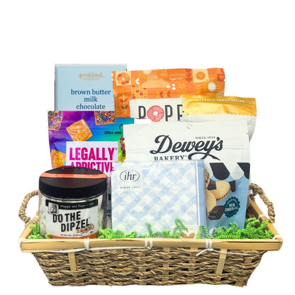 Easter gift basket full of gourmet foods that are made in North Carolina, including cookies, chocolates, cheese straws, pretzels, and beverage napkins.