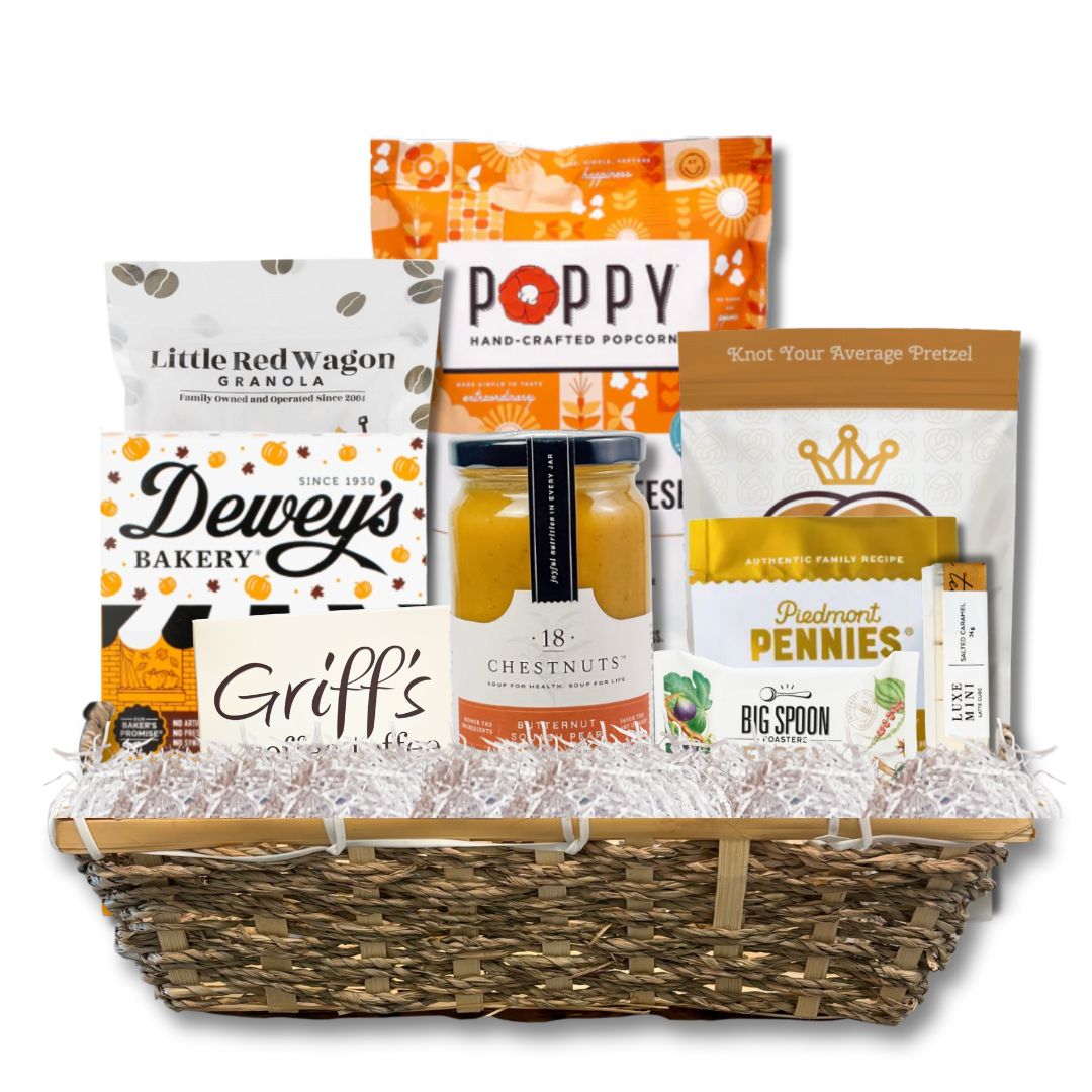 Assembled Fall Flavors Gourmet Gift Basket featuring North Carolina-made snacks and soup, displayed in a handwoven basket on a white background