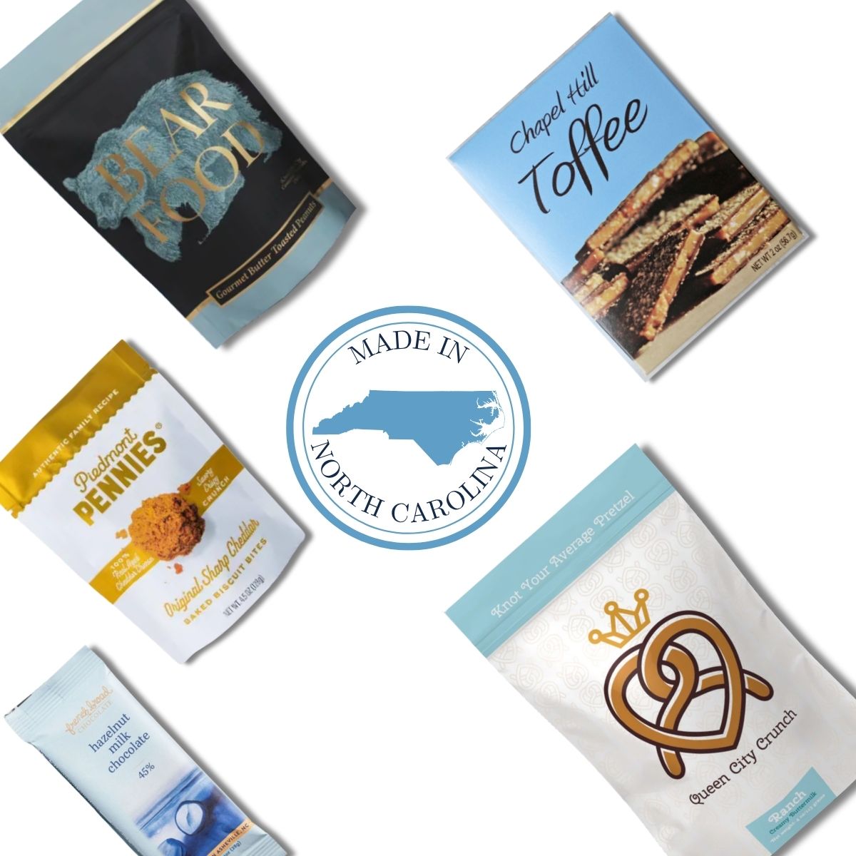 Carolina Blue gourmet items arranged around Made In North Carolina emblem for event welcome box